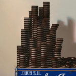 Top right detail of Stacks of oreos with fallen stacks on ground