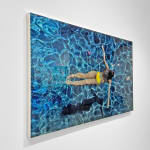 Mixed media and resin work of aerial view of girl swimming on canvas