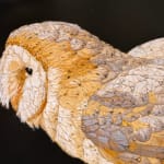 Painting of a brown owl on a ledge