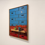 Painting of stacked crates and an apple with a bucket of paint
