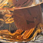 Painting of Manhattan in a glass with in-progress Crowssword Puzzles