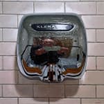 Painting of the artist reflected in a hand dryer