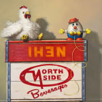 Still life painting of a toy chicken and an egg