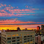 Colorful sunset over Manhattan buildings