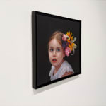 Portrait of a little girl with flowers in her hair