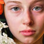 Painting of a girl with flowers in her hair