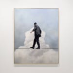 Man in business suit walking on a tightwire