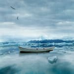 Tom Chambers Archival pigment print of a boat in an icy body of water with mountains in the distance
