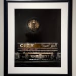 "Radio City" in a black frame with matting