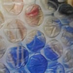 painting of a group of people doing a cheers over bubble wrap