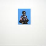 paper collage of a young child on a blue background