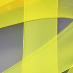 abstract fabric collage with a snippet of a photo of a person wearing a rain jacket
