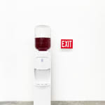 water cooler with an exit sign