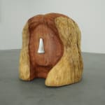 wood carved head with a metal cast nose