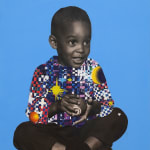 paper collage of a young child on a blue background