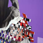 paper collage of a young child on a purple background
