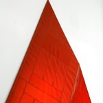 red arrow wall lamp mounted on a white wall