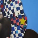 paper collage of a young child on a blue background