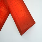 red arrow wall lamp mounted on a white wall