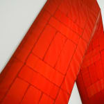 red arrow wall lamp mounted on a white wall