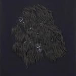 small ceramic needles sewn to a dark indigo canvas
