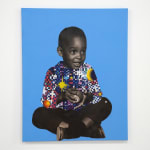 paper collage of a young child on a blue background