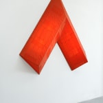 red arrow wall lamp mounted on a white wall