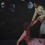 photo of a woman picking up a man off the ground