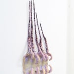 abstract pink sculpture resembling a mouth