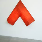 red arrow wall lamp mounted on a white wall