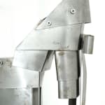 metal sculpture of an exaggerated woman's high heel