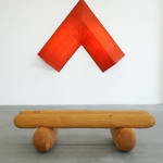 red arrow wall lamp mounted on a white wall