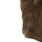 brown hair sculpture on a white pedestal
