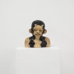 ceramic bust of a person with long hair and horns