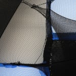 abstract black and red fabric stretched on bars withe a photo of a dog