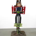 sculpture of a man on a scooter