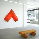 red arrow wall lamp mounted on a white wall