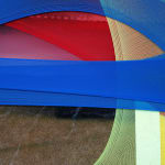 abstract fabric collage with a snippet of a photo of a person wearing a rain jacket