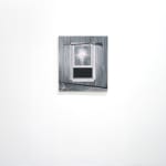 black and white painting of a gun hung above a window