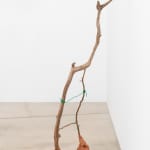 installation view of a clay, bronze, wood, and wire sculpture