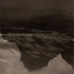 Five inkjet prints depicting a dark ocean and mountains.