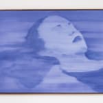 a deep indigo image that depicts a woman with her eyes closed floating in water