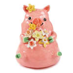 Katie Kimmel's ceramic sculpture of a pig holding flowers