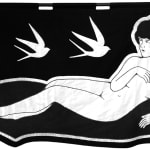 embroidered black and white banner of a nude woman reclining and three birds