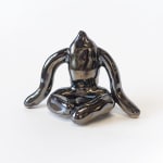 ceramic piece by Jocelyn Tsaih of a silver figure sitting