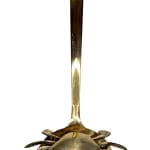 Sculpture of a brass crab with an underwater scene inside of the crab shell