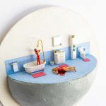miniature diorama by Abigail Goldman a bloody woman washing herself in the shower next to a body bleeding out on the floor