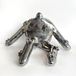 silver ceramic work with Jocelyn Tsaih of a body sitting with flowers on it