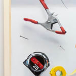 detail view of clamp and tape measure