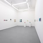 white gallery walls with small artworks